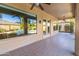 Spacious covered patio features tiled flooring, large windows and recessed lighting at 4241 E Andre Ave, Gilbert, AZ 85298