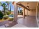 Covered patio with ceiling fans overlooking the pool and lush landscaping at 4241 E Andre Ave, Gilbert, AZ 85298
