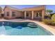 Sparkling pool with steps surrounded by a patio and lush greenery at 4241 E Andre Ave, Gilbert, AZ 85298