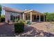 Nice backyard featuring a covered patio with an outdoor seating area and low-maintenance landscaping at 4446 E Woodridge Dr, Phoenix, AZ 85032