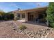Relaxing backyard featuring a covered patio with an outdoor seating area and low-maintenance landscaping at 4446 E Woodridge Dr, Phoenix, AZ 85032