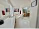 Bright bathroom featuring dual sinks, framed mirrors, and tile flooring at 4446 E Woodridge Dr, Phoenix, AZ 85032