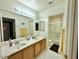 Bathroom boasting dual sinks, ample counter space, and a walk-in shower at 4446 E Woodridge Dr, Phoenix, AZ 85032