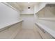 Walk-in closet featuring plenty of shelving and storage space for organized wardrobe at 4446 E Woodridge Dr, Phoenix, AZ 85032