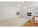 Bright living room with soaring ceilings, modern fireplace, and large windows at 4446 E Woodridge Dr, Phoenix, AZ 85032