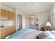 Bedroom featuring built in storage, en suite access to the sun room, and neutral paint at 5735 E Mcdowell Rd # 147, Mesa, AZ 85215