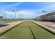 Bocce ball court for residents, enclosed with fencing and featuring well-maintained synthetic turf at 5735 E Mcdowell Rd # 147, Mesa, AZ 85215