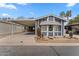 Charming home featuring desert landscaping, a covered carport, and an inviting exterior at 5735 E Mcdowell Rd # 147, Mesa, AZ 85215