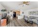 Light-filled living area with seamlessly integrated kitchen and dining, and modern flooring at 5735 E Mcdowell Rd # 147, Mesa, AZ 85215