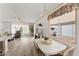 Open concept living area featuring a dining table, plenty of natural light, and comfortable seating at 5735 E Mcdowell Rd # 147, Mesa, AZ 85215