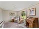 Comfortable sun room with plush recliner, writing desk and chair and view to the outdoors at 5735 E Mcdowell Rd # 147, Mesa, AZ 85215