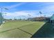 Well-maintained tennis court with professional lighting and secure fencing, ensuring a premier recreational experience for residents at 5735 E Mcdowell Rd # 147, Mesa, AZ 85215