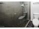 Modern bathroom with tiled shower stall with glass door, toilet, and sleek fixtures at 6533 N 10Th Pl, Phoenix, AZ 85014