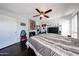 Comfortable bedroom with a ceiling fan, fireplace, and built-in media center at 6533 N 10Th Pl, Phoenix, AZ 85014
