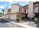 Charming townhouse with a private garage, landscaped walkway, and inviting front entrance at 6533 N 10Th Pl, Phoenix, AZ 85014