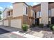 Charming townhouse with a private garage, landscaped walkway, and inviting front entrance at 6533 N 10Th Pl, Phoenix, AZ 85014