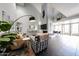 Open living space featuring vaulted ceilings, a fireplace, and an adjacent dining area at 6533 N 10Th Pl, Phoenix, AZ 85014