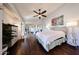 Bright main bedroom with vaulted ceilings, wood floors, neutral decor, and walk-in closet at 6533 N 10Th Pl, Phoenix, AZ 85014