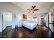 Spacious main bedroom featuring a ceiling fan, wood floors, and neutral decor at 6533 N 10Th Pl, Phoenix, AZ 85014