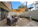 Private outdoor patio featuring ample seating under a large umbrella and a standing patio heater at 6533 N 10Th Pl, Phoenix, AZ 85014