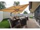 Enjoy your outdoor private patio, featuring comfortable seating, complete with shade and outdoor lighting at 6533 N 10Th Pl, Phoenix, AZ 85014