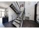 Carpeted staircase features iron railings and plenty of natural light at 6533 N 10Th Pl, Phoenix, AZ 85014
