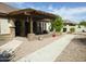 Inviting backyard patio with a charming pergola and desert landscaping at 6687 S Banning St, Gilbert, AZ 85298