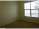Comfortable bedroom with natural light and carpeted flooring at 6687 S Banning St, Gilbert, AZ 85298