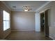 Spacious bedroom with neutral walls, a window, and a ceiling fan at 6687 S Banning St, Gilbert, AZ 85298