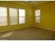 Bedroom with natural light and large windows, featuring carpeted flooring at 6687 S Banning St, Gilbert, AZ 85298