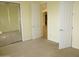 Bedroom with carpet and mirrored closet, featuring a doorway into the hall at 6687 S Banning St, Gilbert, AZ 85298