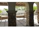 Covered patio with stone pillars and pavers, offering a charming outdoor space at 6687 S Banning St, Gilbert, AZ 85298