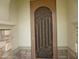 Elegant front door with security screen featuring an artistic scroll design at 6687 S Banning St, Gilbert, AZ 85298