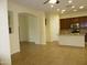 Open-concept living area flowing into a modern kitchen with a center island at 6687 S Banning St, Gilbert, AZ 85298