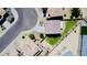 Aerial view showcases a backyard with lush green lawn, brick-paved patio, privacy fence, and landscaping at 7312 S 13Th Way, Phoenix, AZ 85042