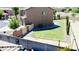Well-maintained backyard featuring lush lawn, block fence, and pathway to side of home at 7312 S 13Th Way, Phoenix, AZ 85042