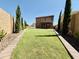 Large backyard featuring manicured lawn and classic landscaping at 7312 S 13Th Way, Phoenix, AZ 85042