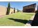 Expansive, well-kept lawn with brick-lined landscaping and ample space at 7312 S 13Th Way, Phoenix, AZ 85042