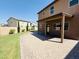 Spacious backyard featuring a covered patio and pristine lawn at 7312 S 13Th Way, Phoenix, AZ 85042