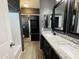 Stylish bathroom with granite countertops, dual sinks, and a sliding glass door shower at 7312 S 13Th Way, Phoenix, AZ 85042
