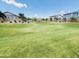 Expansive green space with mature trees, a covered picnic area, and lush landscaping at 7312 S 13Th Way, Phoenix, AZ 85042