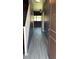 Inviting entryway showcasing wood-look tile floors, a staircase, and a view into an adjacent room at 7312 S 13Th Way, Phoenix, AZ 85042