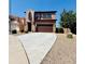 Charming two-story home with a well-manicured front yard, spacious two-car garage and desert landscaping at 7312 S 13Th Way, Phoenix, AZ 85042
