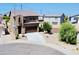 Attractive exterior showcasing a two-story home with desert landscaping and a spacious driveway at 7312 S 13Th Way, Phoenix, AZ 85042