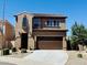 Charming two-story home with a well-manicured front yard and a spacious two-car garage at 7312 S 13Th Way, Phoenix, AZ 85042