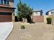 Low maintenance front yard featuring gravel, pavers, mature tree, and bushes at 7312 S 13Th Way, Phoenix, AZ 85042