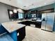 Modern kitchen with black cabinets, granite countertops and stainless steel appliances at 7312 S 13Th Way, Phoenix, AZ 85042