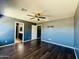 Inviting primary bedroom showcasing wood floors, ensuite bathroom, and a serene atmosphere at 7312 S 13Th Way, Phoenix, AZ 85042