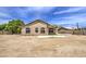 Back of house with windows, a covered patio and a large backyard at 863 S Del Rancho --, Mesa, AZ 85208