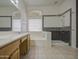 Bathroom featuring a tiled shower, bathtub and large window at 863 S Del Rancho --, Mesa, AZ 85208